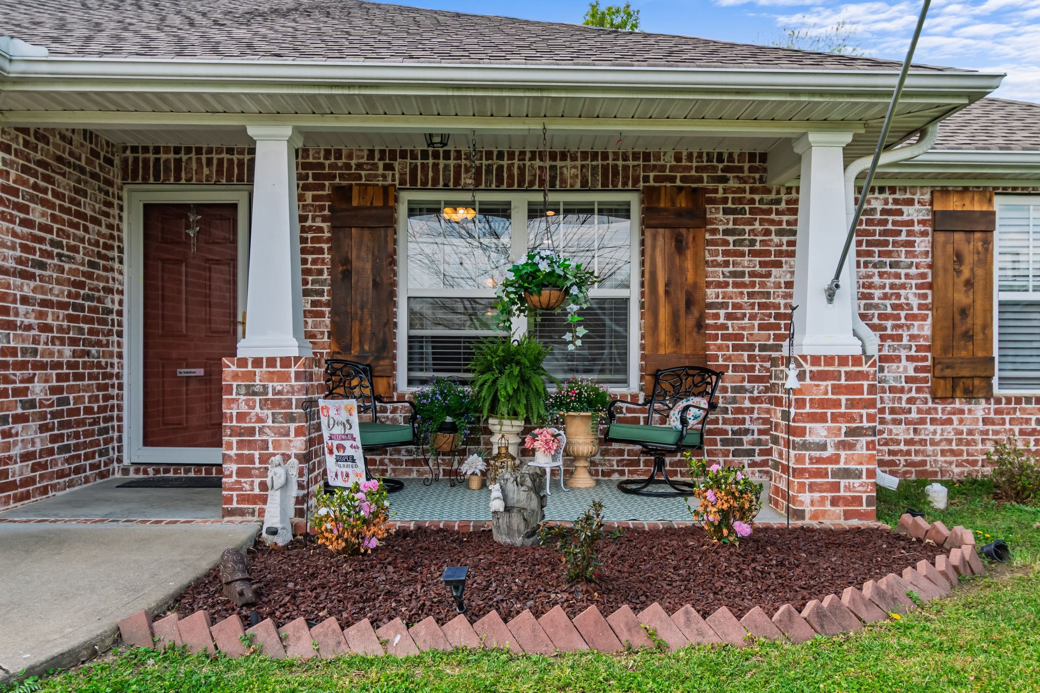4989 Morning Dove Lane Spring Hill, TN 37174 - Photo 4 of 28 a view of backyard with a chair and potted plants