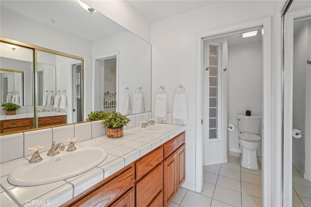 11709 Mint Canyon Road Agua Dulce, CA 91390 - Photo 15 of 49 a bathroom with a sink and a mirror
