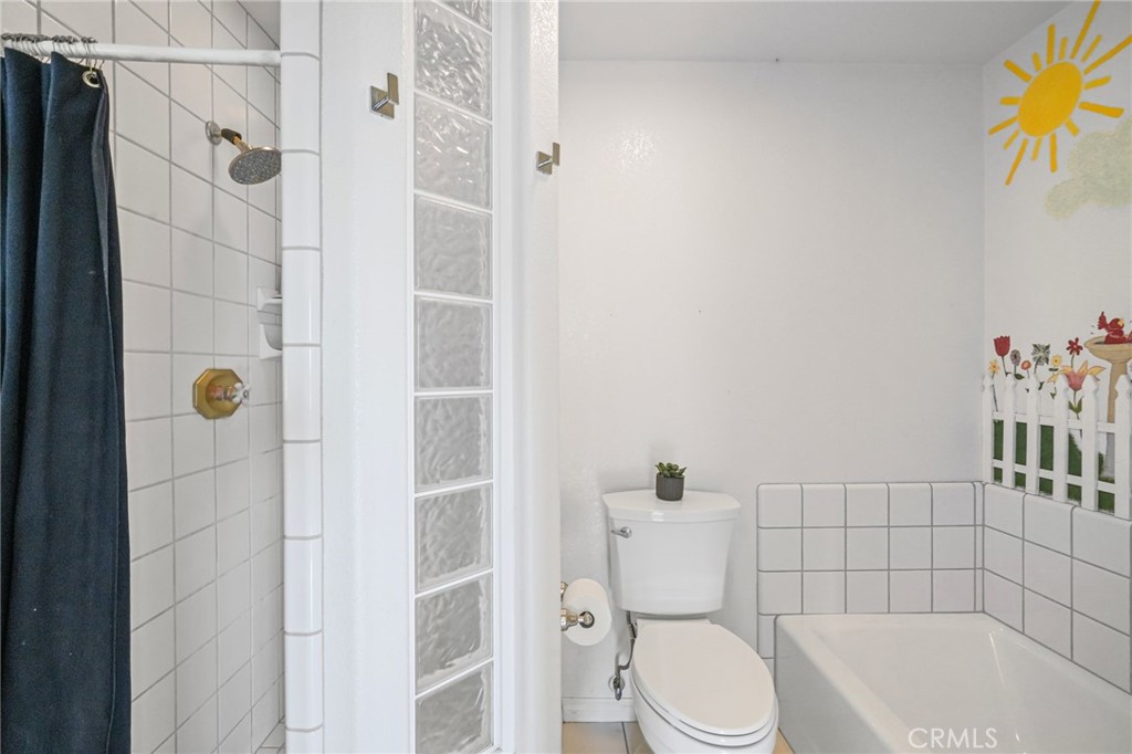 11709 Mint Canyon Road Agua Dulce, CA 91390 - Photo 16 of 49 a bathroom with a toilet and shower