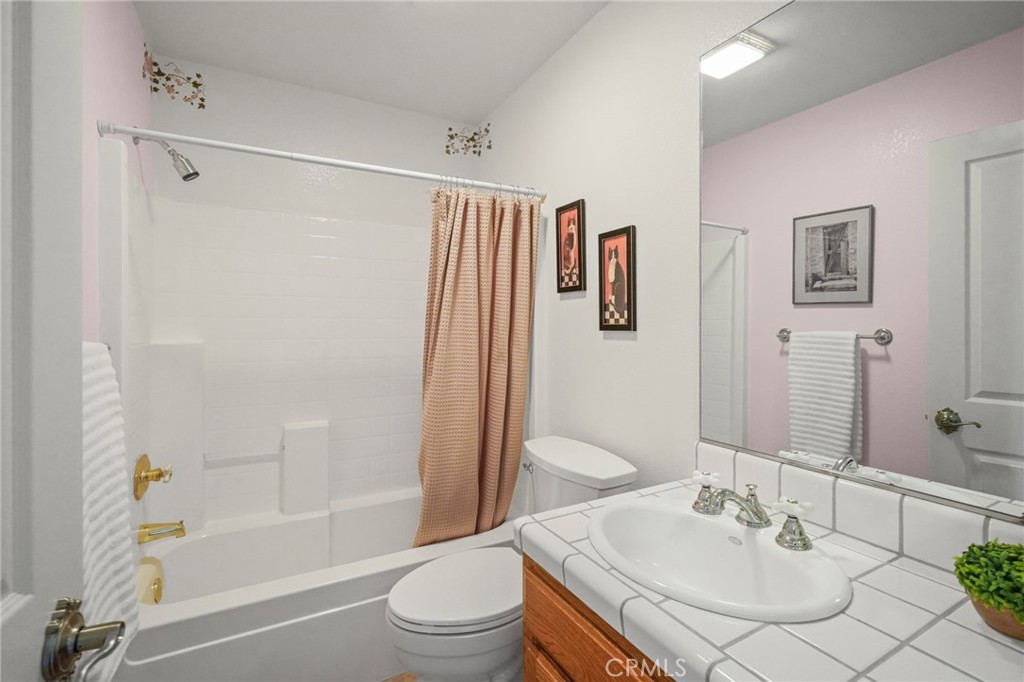 11709 Mint Canyon Road Agua Dulce, CA 91390 - Photo 19 of 49 a bathroom with a sink toilet and shower