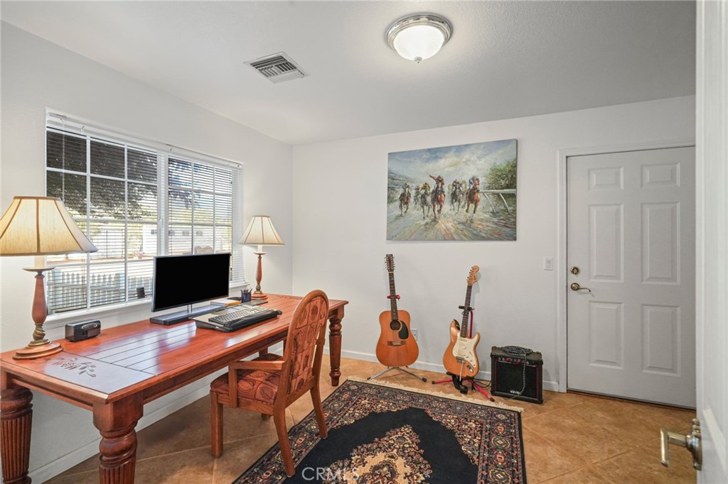 11709 Mint Canyon Road Agua Dulce, CA 91390 - Photo 22 of 49 a view of a workspace with furniture