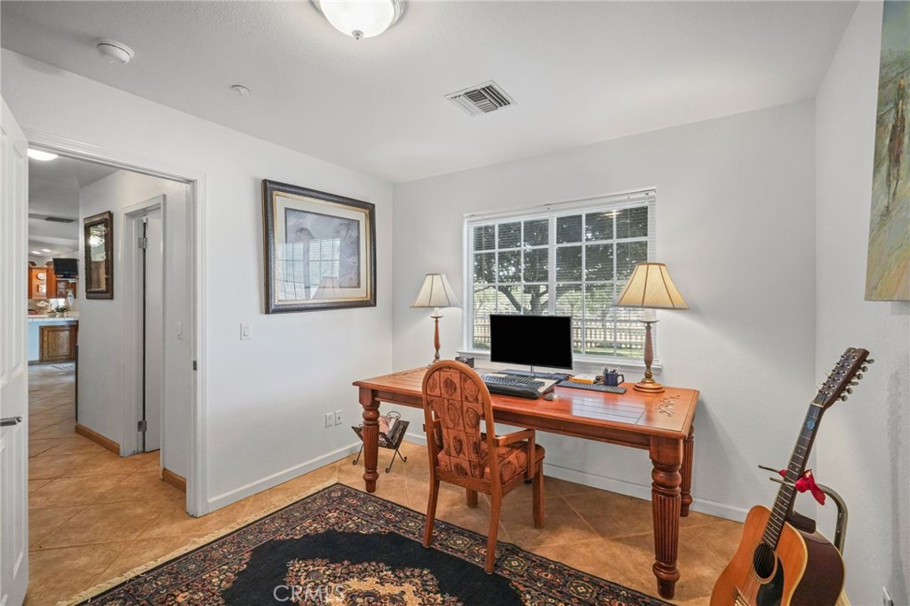 11709 Mint Canyon Road Agua Dulce, CA 91390 - Photo 23 of 49 a workspace with furniture and a window
