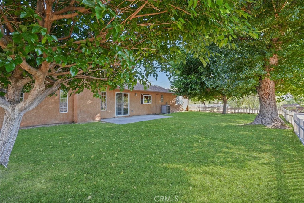 11709 Mint Canyon Road Agua Dulce, CA 91390 - Photo 27 of 49 a view of a house with backyard and a tree