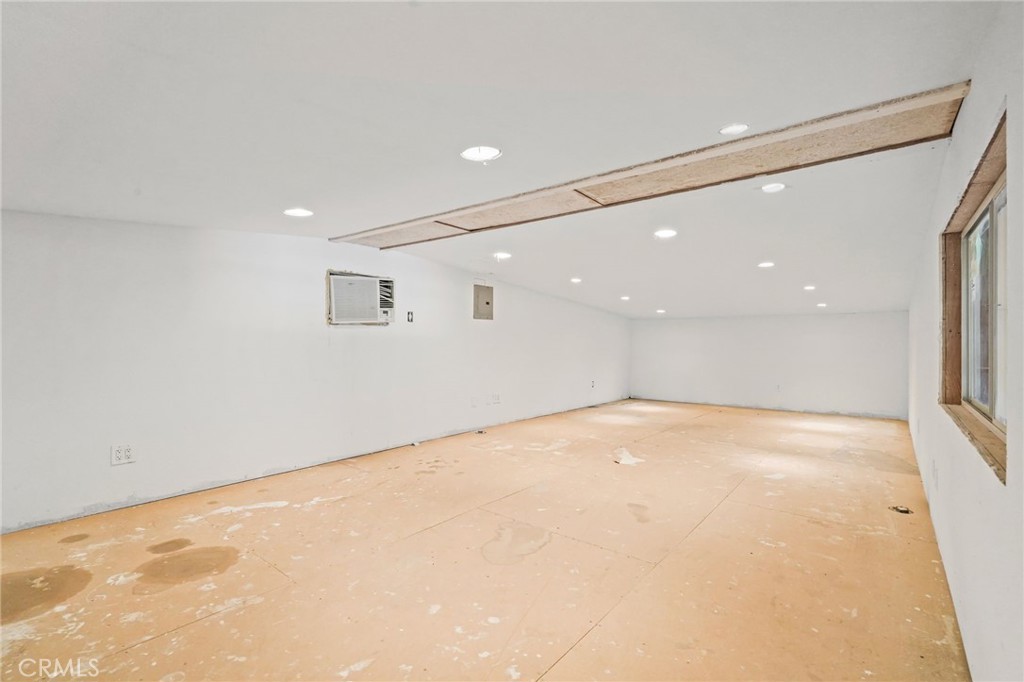 11709 Mint Canyon Road Agua Dulce, CA 91390 - Photo 38 of 49 an empty room with a empty space and windows