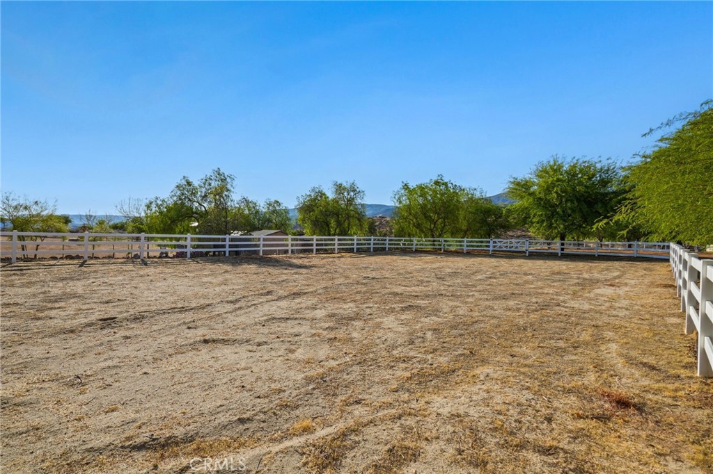 11709 Mint Canyon Road Agua Dulce, CA 91390 - Photo 39 of 49 a view of a field with trees in the background