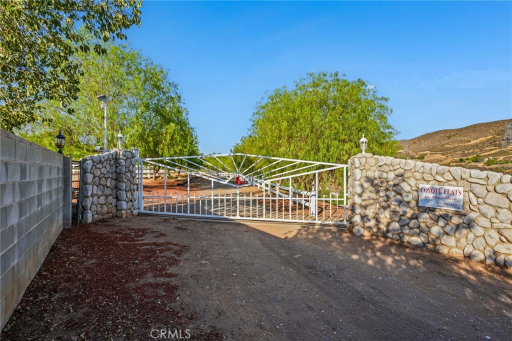 11709 Mint Canyon Road Agua Dulce, CA 91390 - Photo 48 of 49 a view of a pathway of a building with large trees