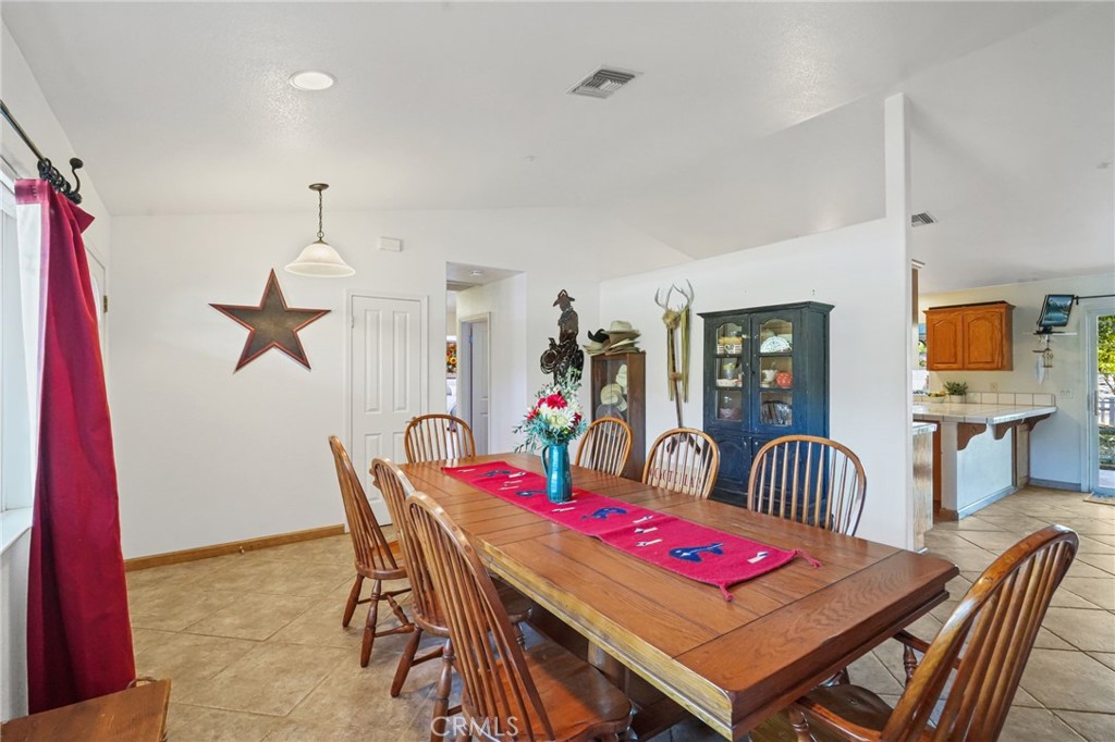 11709 Mint Canyon Road Agua Dulce, CA 91390 - Photo 10 of 49 a dining room with furniture and wooden floor