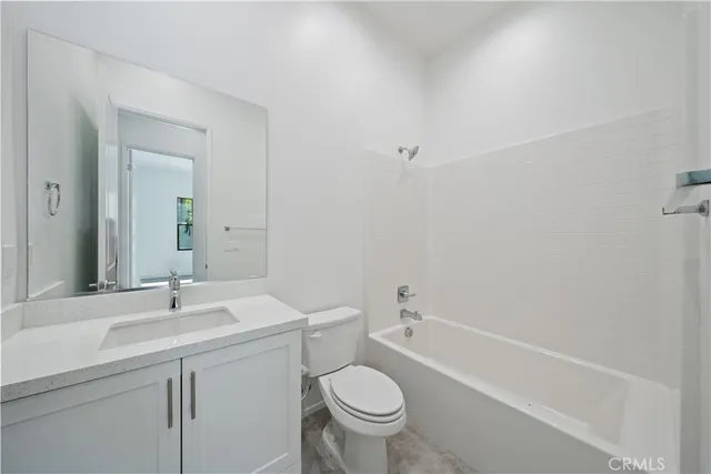 a bathroom with a sink toilet and a bathtub