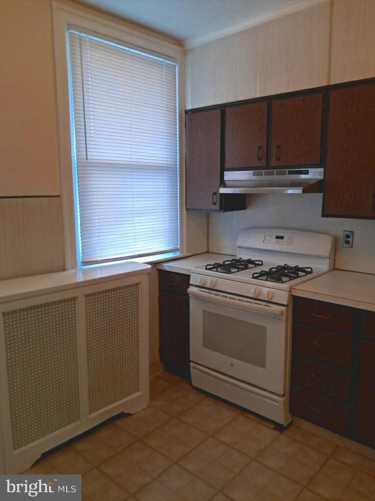 652 Jamestown Avenue Philadelphia, PA 19128 - Photo 12 of 13 a kitchen with granite countertop cabinets stainless steel appliances and a sink