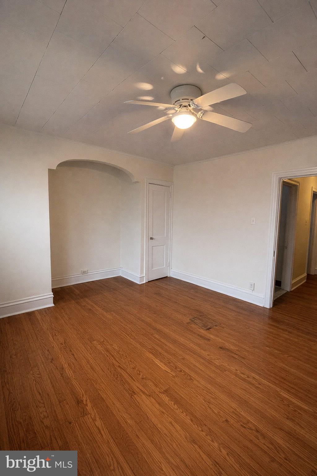 652 Jamestown Avenue Philadelphia, PA 19128 - Photo 8 of 13 a view of empty room with wooden floor and fan