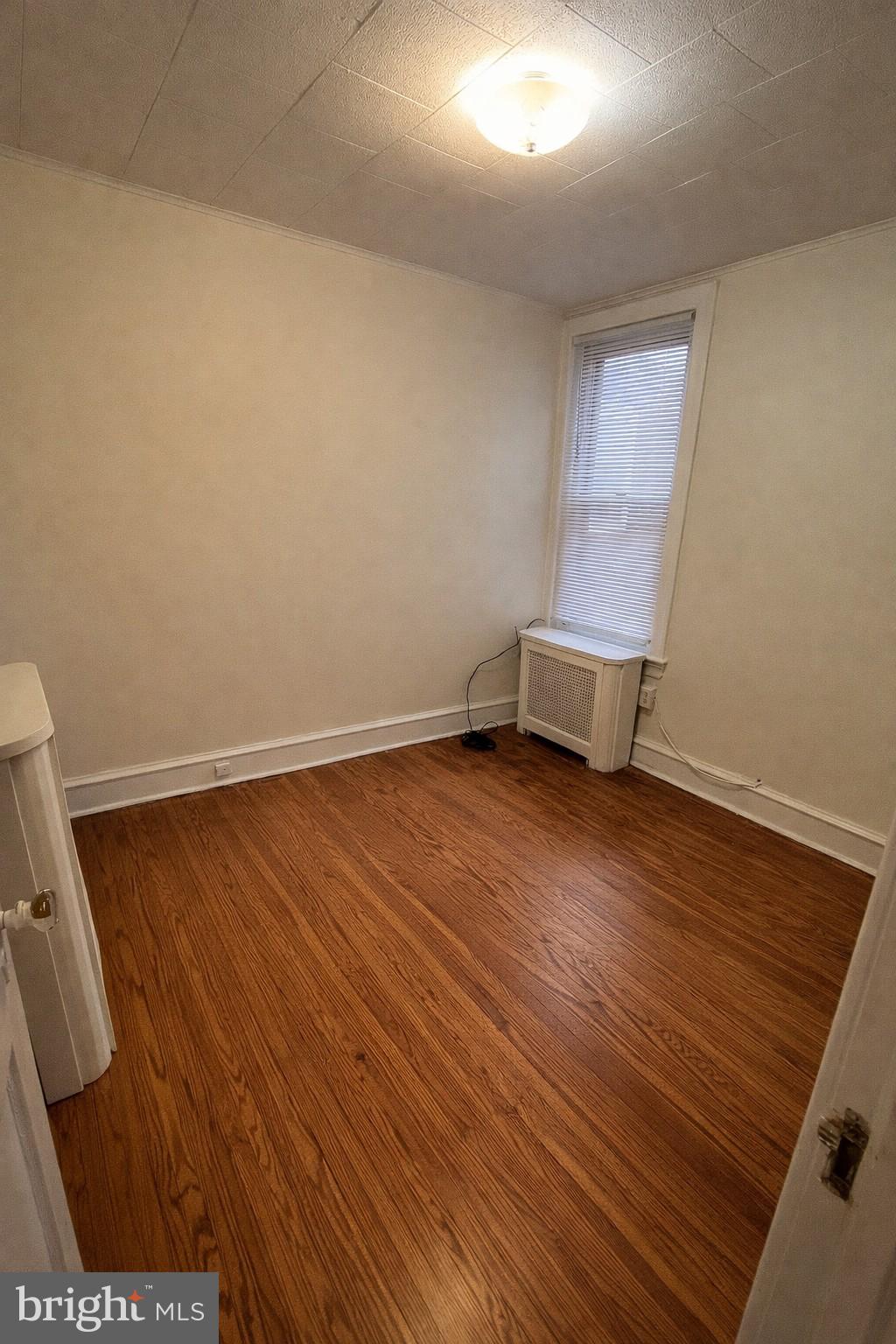 652 Jamestown Avenue Philadelphia, PA 19128 - Photo 9 of 13 an empty room with wooden floor