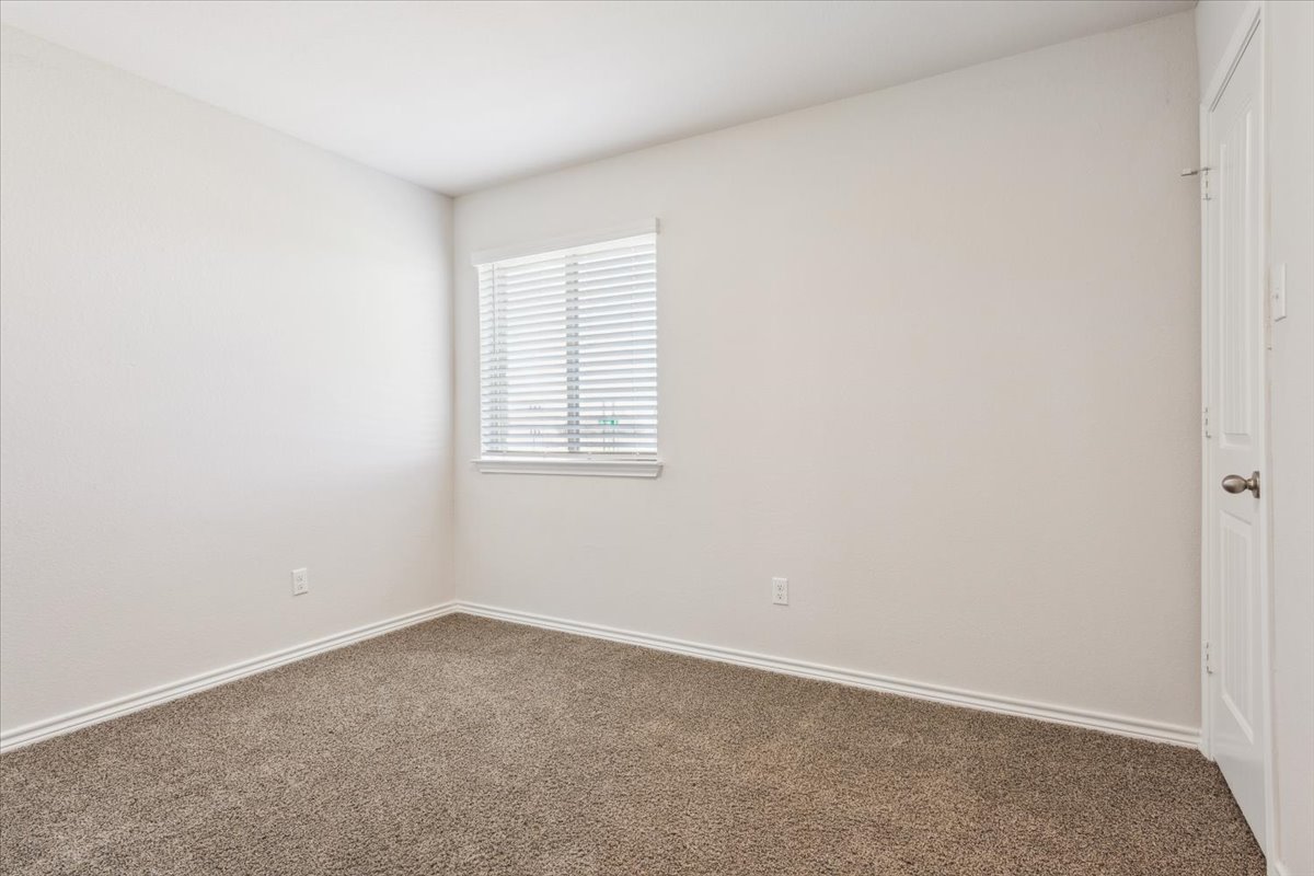 5830 Copano Road Belton, TX 76513 - Photo 27 of 34 Carpeted spare room with baseboards