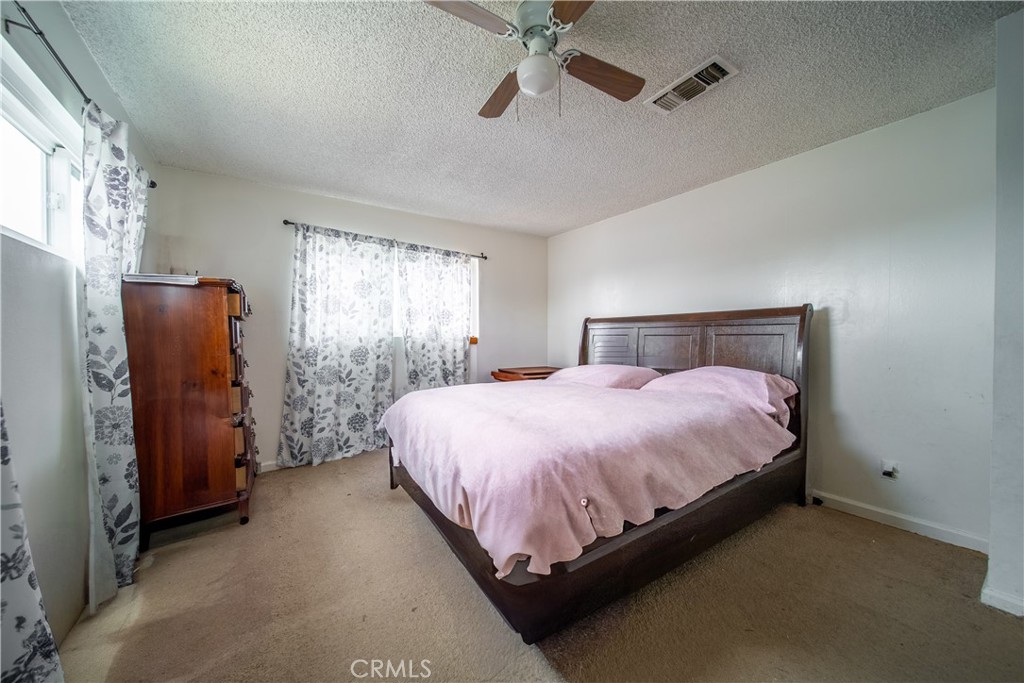 500 South Clymar Avenue Compton, CA 90220 - Photo 13 of 20 a bedroom with a bed and a window