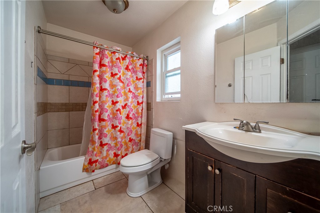 500 South Clymar Avenue Compton, CA 90220 - Photo 14 of 20 a bathroom with a sink a toilet and shower