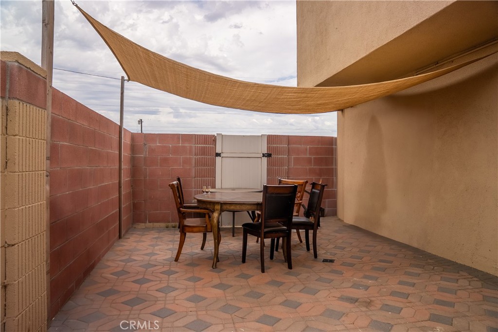 500 South Clymar Avenue Compton, CA 90220 - Photo 15 of 20 a view of a dining room with furniture and chandelier