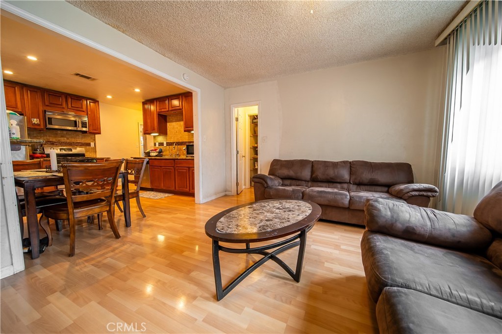 500 South Clymar Avenue Compton, CA 90220 - Photo 4 of 20 a living room with furniture and a window