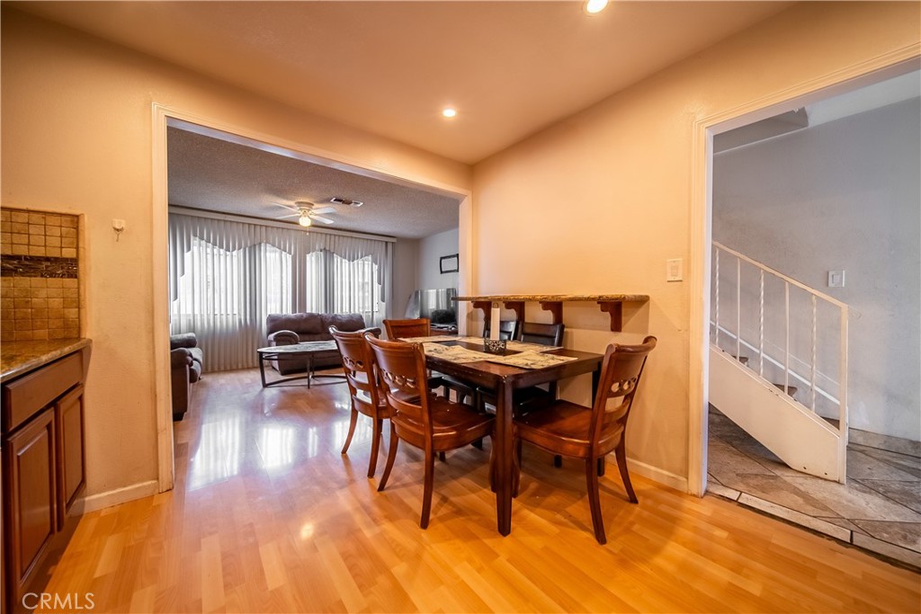 500 South Clymar Avenue Compton, CA 90220 - Photo 6 of 20 a view of a dining room with furniture and wooden floor