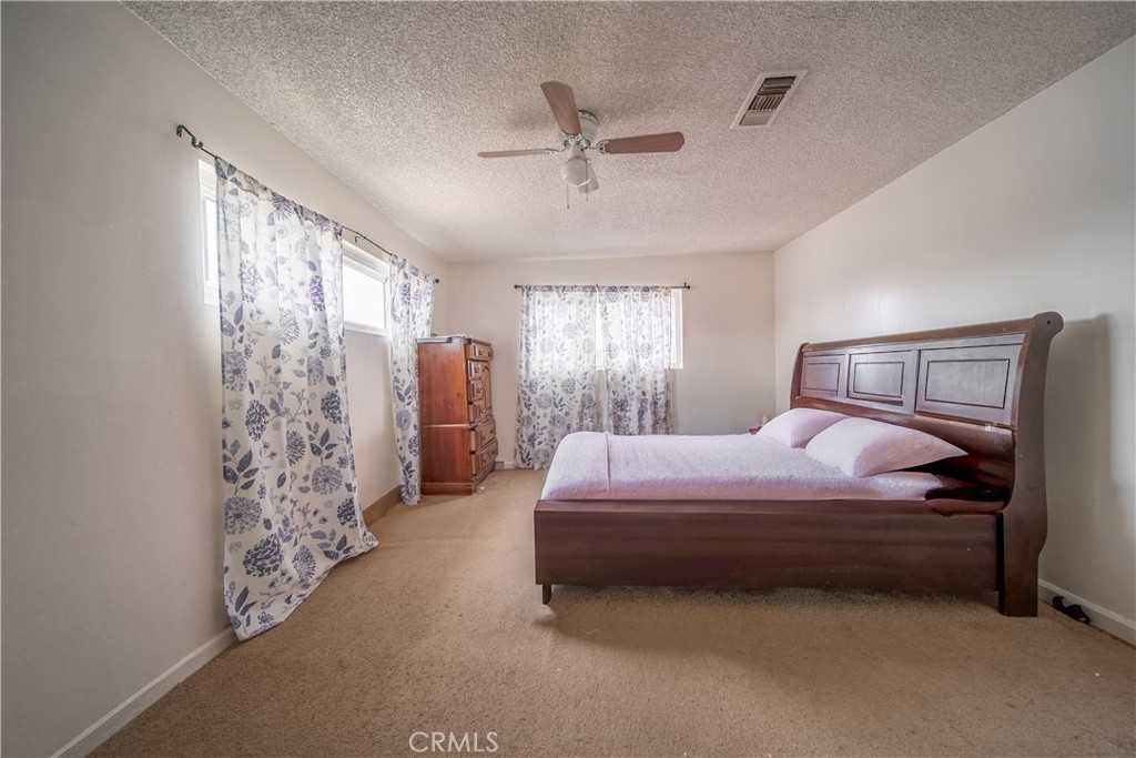 500 South Clymar Avenue Compton, CA 90220 - Photo 10 of 20 a bedroom with a bed and window