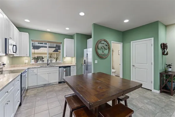 a view of a livingroom with entryway and furniture