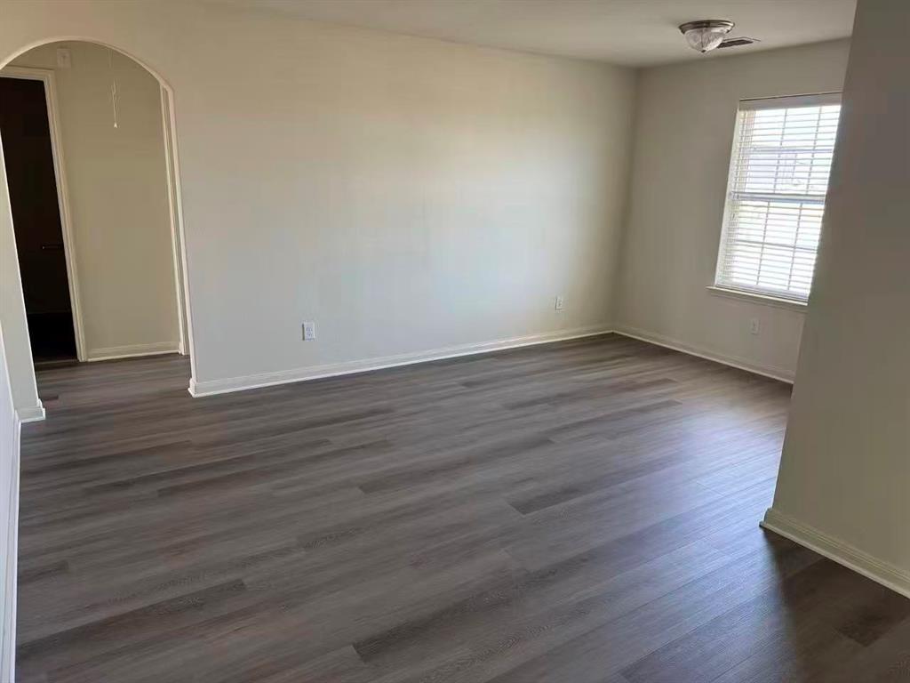 1806 Douglas Street Howe, TX 75459 - Photo 11 of 15 an empty room with wooden floor and windows