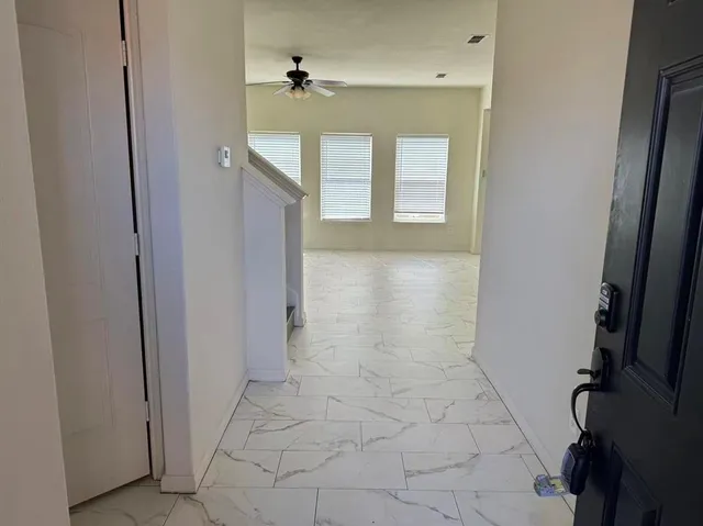 a view of a hallway with entryway