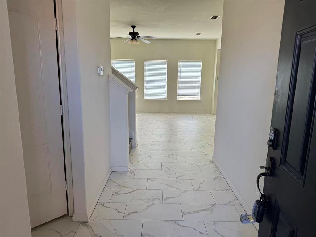 1806 Douglas Street Howe, TX 75459 - Photo 3 of 15 a view of a hallway with entryway
