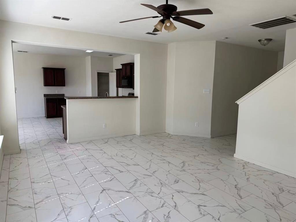 1806 Douglas Street Howe, TX 75459 - Photo 4 of 15 a view of a livingroom with a flat screen tv