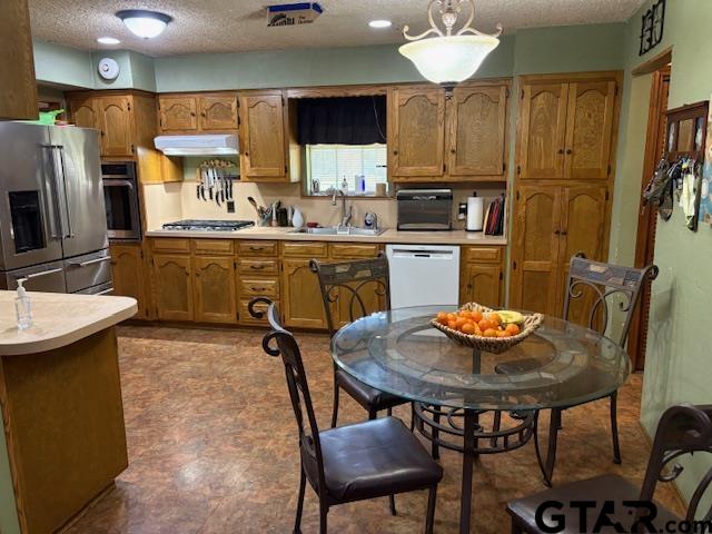 449 Ruth Street Hawkins, TX 75765 - Photo 17 of 33 a kitchen with a dining table and chairs