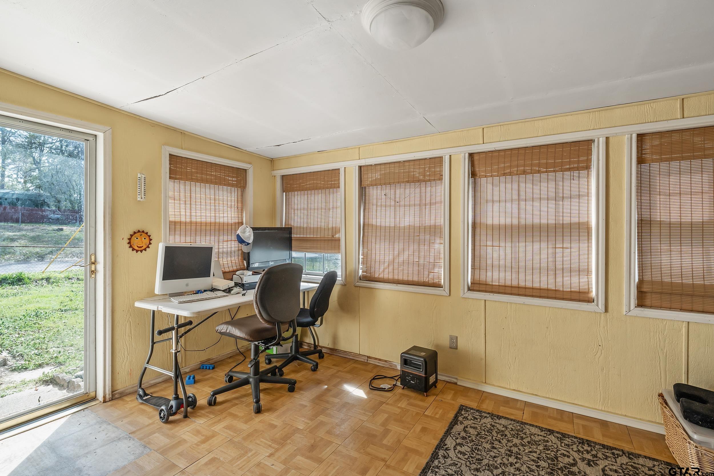 449 Ruth Street Hawkins, TX 75765 - Photo 21 of 33 a view of a workspace with furniture and a window