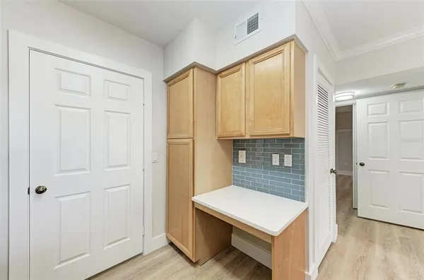 a room that has a bed and a dresser in it