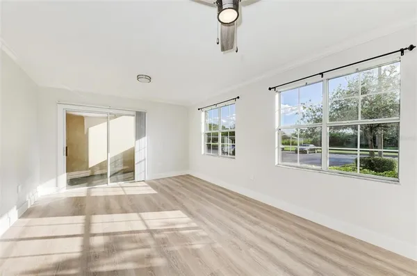 a view of an empty room with a window