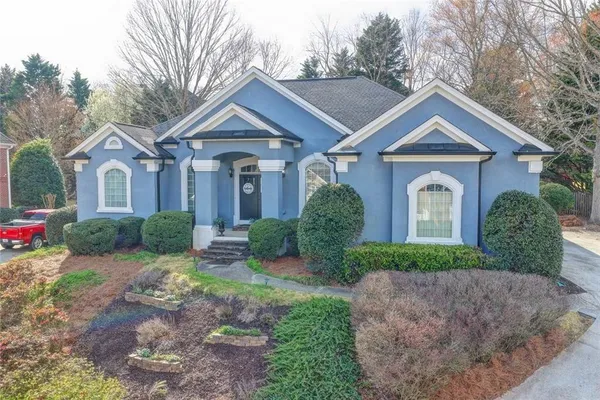 a front view of a house with a yard