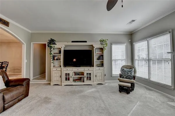 a spacious bathroom with double vanity and a mirror