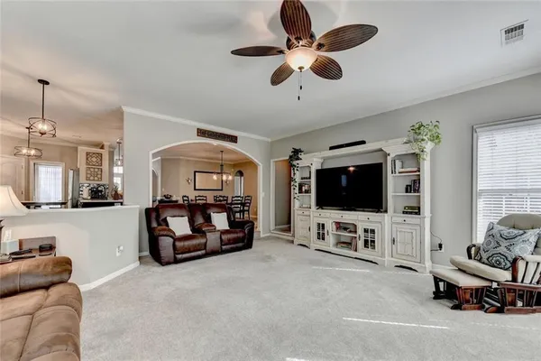 a bathroom with double vanity and a mirror