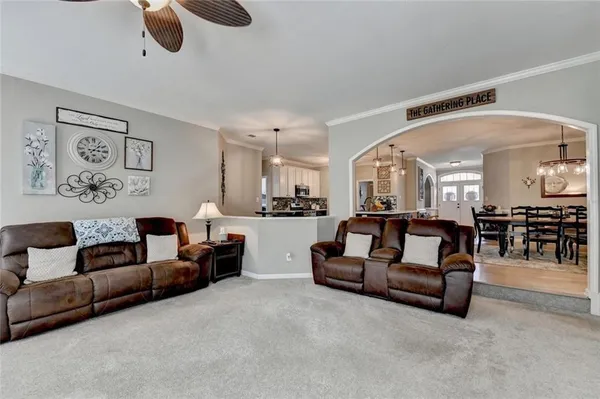 a bathroom with a sink mirror vanity and toilet