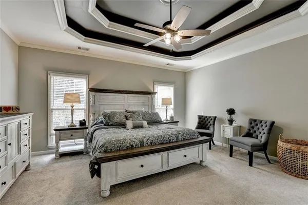 a bedroom with a bed a window and gym equipment