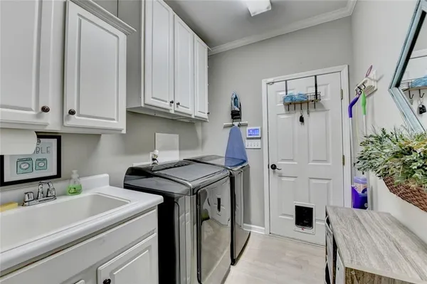 an aerial view of a house with swimming pool and outdoor seating