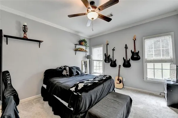 an aerial view of residential houses with outdoor space and swimming pool