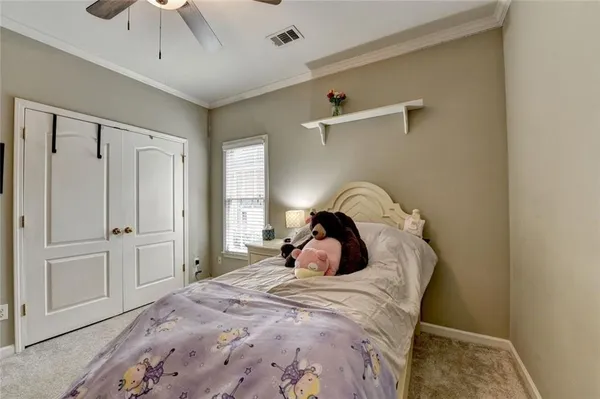 a view of a patio with table and chairs and potted plants