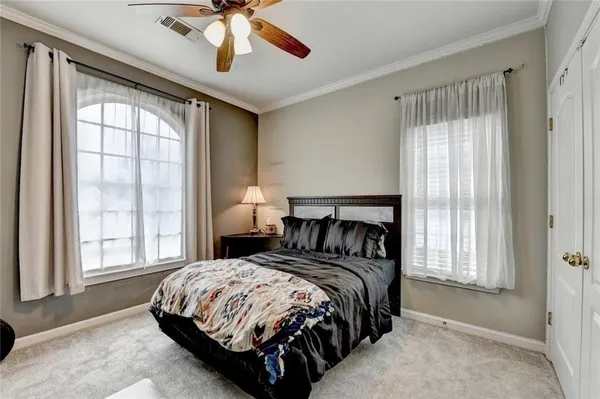 a childrens park with lots of swings slides and slide in the back