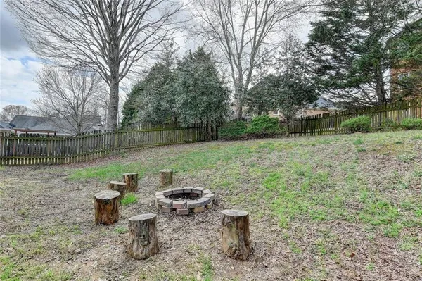 an aerial view of a house with swimming pool and outdoor space
