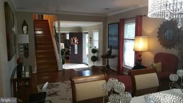 a living room with furniture and a lamp