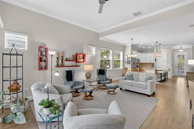 a living room with fireplace furniture and a flat screen tv