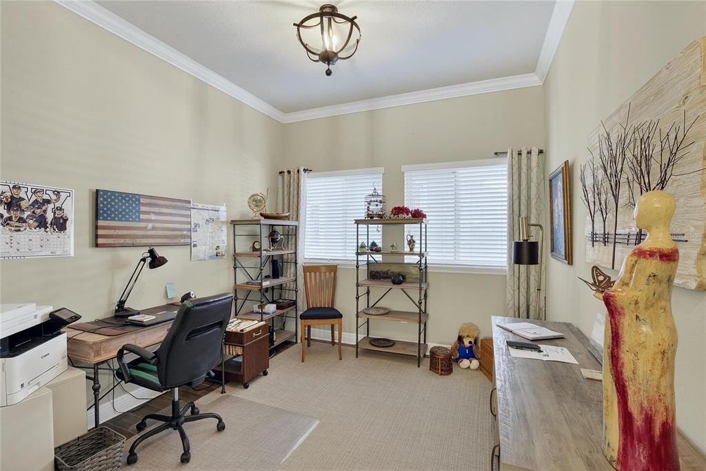 6020 Plover Meadow Street Lithia, FL 33547 - Photo 17 of 41 a view of a workspace with furniture and a window