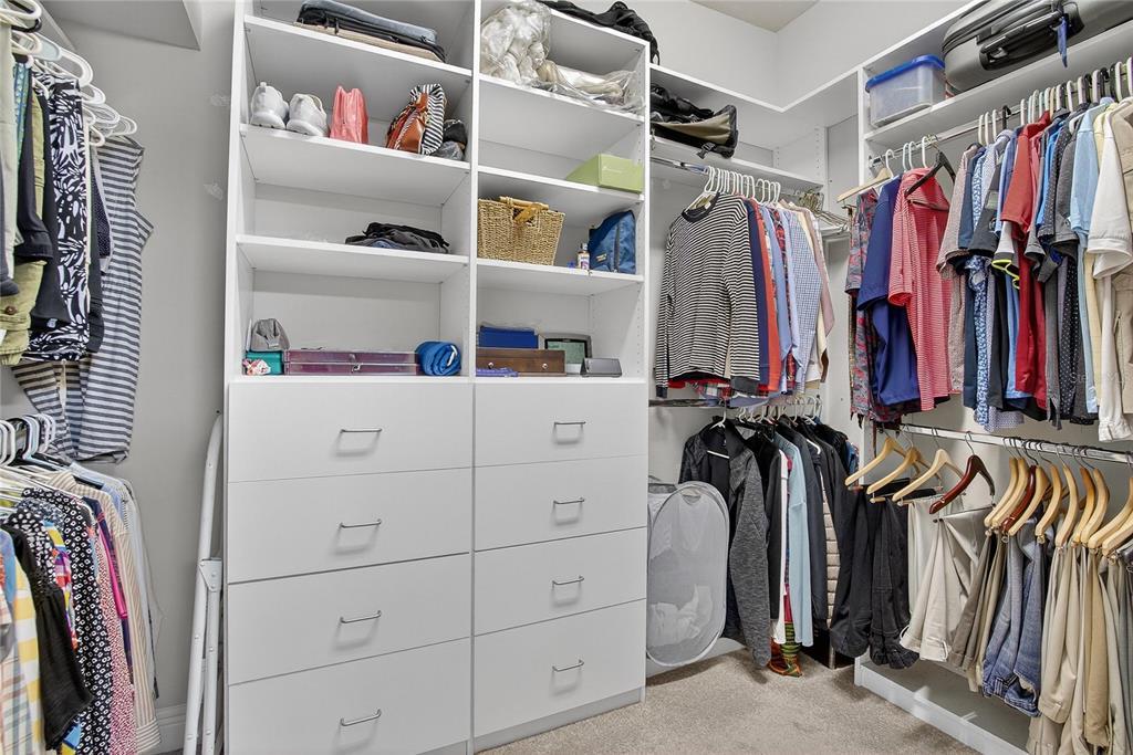 6020 Plover Meadow Street Lithia, FL 33547 - Photo 22 of 41 a view of walk in closet with clothes and shoes