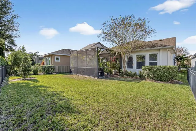 a front view of a house with yard and trees