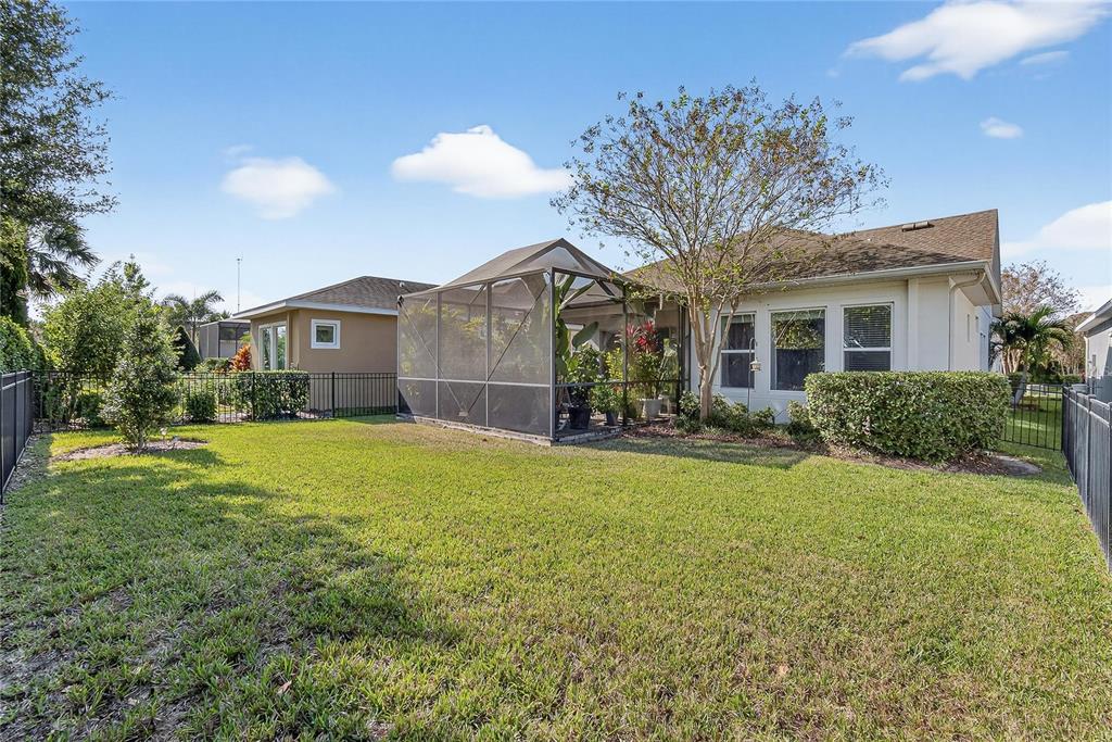 6020 Plover Meadow Street Lithia, FL 33547 - Photo 30 of 41 a view of a house with a yard and potted plants
