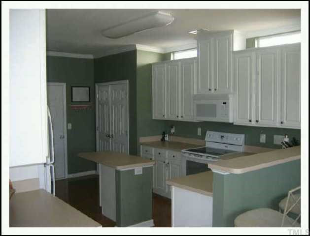 8416 Lunar Stone Place Raleigh, NC 27613 - Photo 3 of 10 Kitchen with island and bar for entertaining Other
