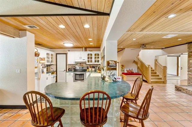 a utility room with stainless steel appliances and toys