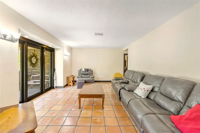 a view of a livingroom with furniture and a window